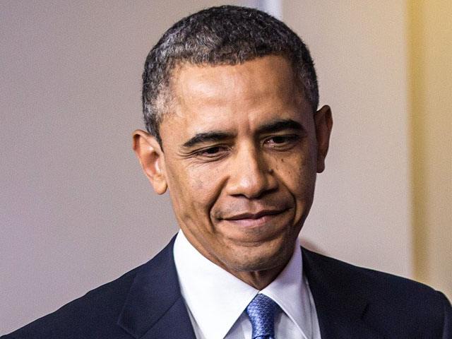Обама с Гавайев подписал закон, откладывающий "фискальный обрыв"