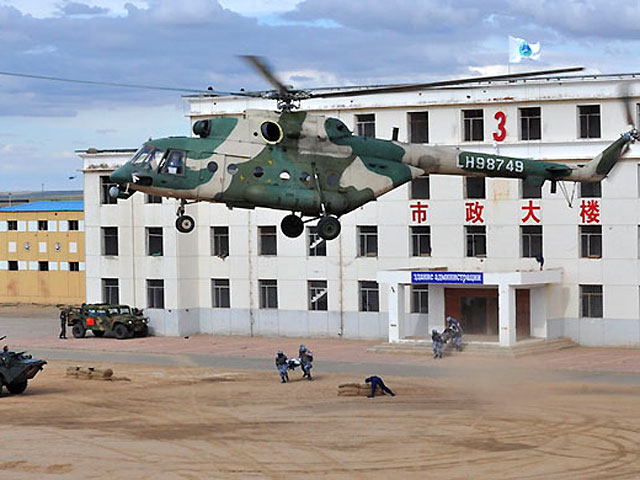 В Китае начались военные учения Шанхайской организации сотрудничества (ШОС) с участием России - "Мирная миссия-2014"