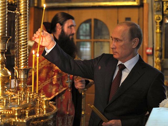 Путин в московском храме почтил память "тех, кто пострадал, защищая людей в Новороссии"