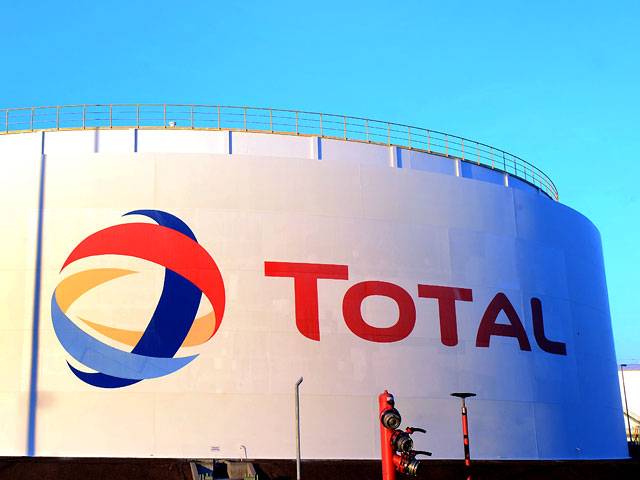 Французская нефтегазовая корпорация Total приостанавливает сотрудничество с российской компанией "Лукойл" по совместной разработке месторождений в Западной Сибири из-за санкций Запада