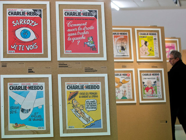 В новом номере французского сатирического издания Charlie Hebdo напечатаны карикатуры на президента России Владимира Путина