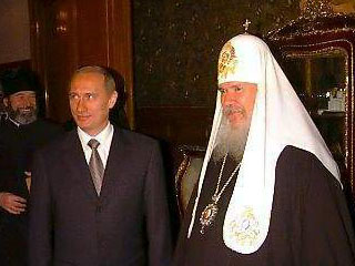 Президент РФ Владимир Путин во время одной из встреч с Патриархом Алексием II. Фото Службы коммуникации ОВЦС МП