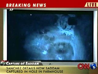 Кроме того, журналистами показали место, где скрывался Саддам. Это оказался темный, тесный, земляной подвал, больше похожий на нору