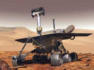 Марсоход Spirit, находящийся на дне кратера Гусева на Марсе, выполнил с помощью микрокамеры, размещенной на его механической руке-манипуляторе, первое фотографирование маленького участка марсианского грунта