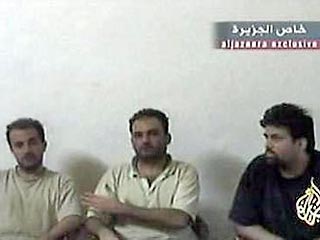 Трое освобожденных в Ираке итальянских заложников вернулись на родину