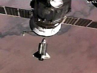 Российский корабль "Союз" доставил на Международную космическую станцию экипаж 14-й основной экспедиции и первую космическую туристку