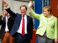 Партия Меркель выигрывает региональные выборы на западе Германии