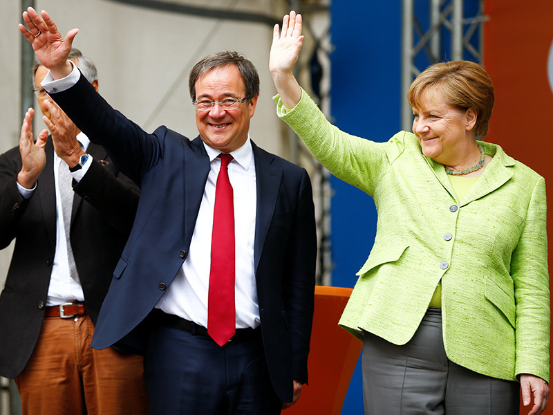Партия Меркель выигрывает региональные выборы на западе Германии
