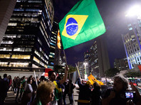 Официально причины отмены поездки не сообщаются, однако, по мнению СМИ, это может быть связано с политическим кризисом в Бразилии
