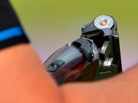 Патрон в винтовке во время квалификационных соревнованиий мужчин по стендовой стрельбе в дисциплине "трап" на ХХХ летних Олимпийских играх в Лондоне